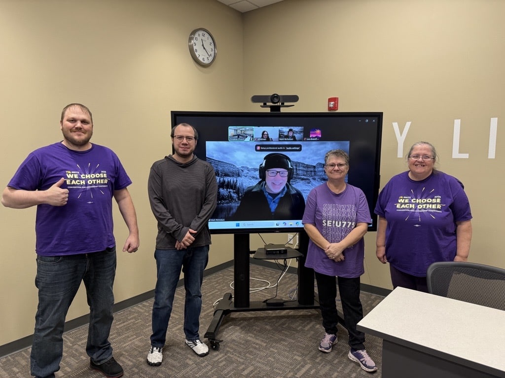 Nic (center left) alongside fellow bargaining team members