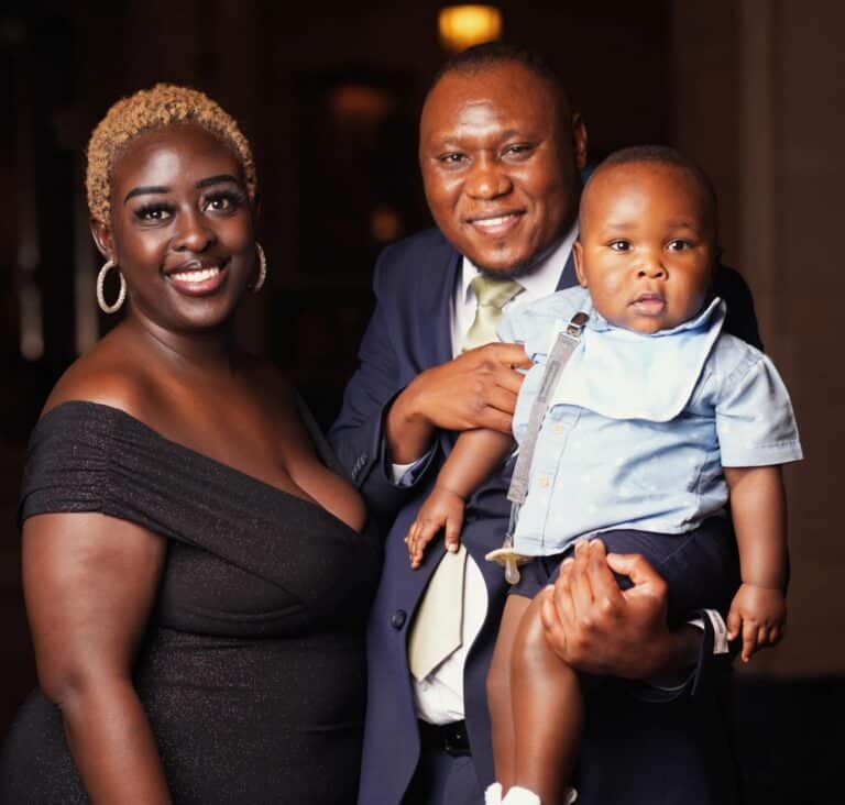 Cece Mokua, left, and her husband, Humphrey Oyoo, pose with their child at a friend's wedding, July 31, 2026.